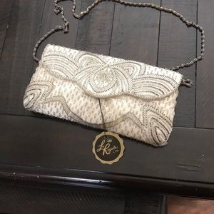 Silver and white clutch